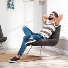 A person relaxing comfortably in a calm setting