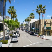A view of Wilshire Boulevard in Los Angeles with its broad roadway and city buildings.
