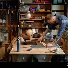 A skilled craftsperson performing precise work.