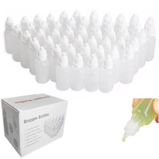 Small medicine bottles labeled for eye and ear drops.