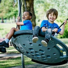 A set of swings in a playground