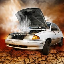 A car stopped at the roadside with its hood raised for repairs.