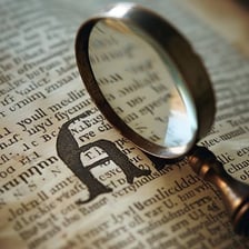 A magnifying glass making printed text appear larger