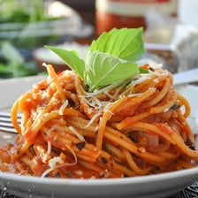 Spaghetti served with red marinara sauce.