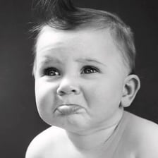 A person showing displeasure by pushing out the lower lip