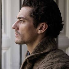 A side-profile portrait showing a prominent human nose.