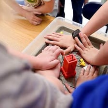 A person carrying out a practical task in a workshop.