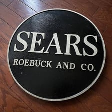 A historic Sears, Roebuck and Co. storefront or company logo.