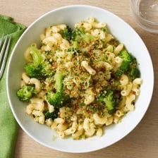 A bowl of short, curved elbow macaroni noodles.