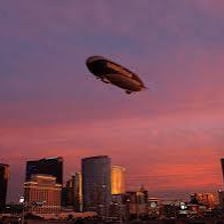 A blimp flying through the sky