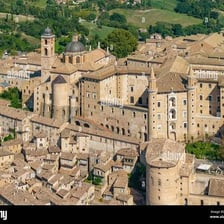An enclosed compound containing several buildings.