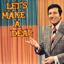 Monty Hall presenting a contestant with a deal on a television game show