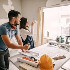 A person working again on a home improvement task, illustrating redoing it.
