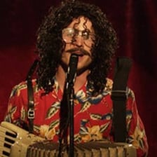 Weird Al Yankovic performing a humorous parody song on stage