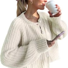 A knitted cardigan sweater displayed with its front buttons visible