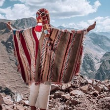 A woven poncho in a traditional Andean style.