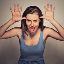 A person speaking with a visibly sarcastic, mocking expression.