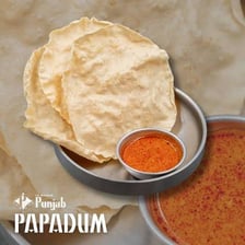 Crisp papadum crackers served with chutney