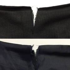 Several visible tears and splits in a piece of fabric