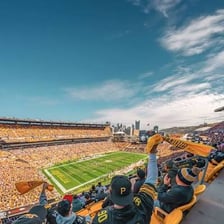 Football players competing in a stadium during a Sunday game.