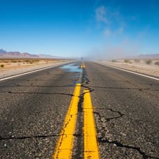 A mirage appearing above a distant desert road