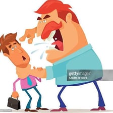 A person forcefully reprimanding someone during a conversation.