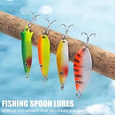 Several metal spoon fishing lures used as artificial bait.