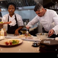 Professional chefs working in a busy restaurant kitchen