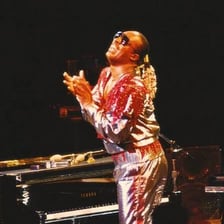 Stevie Wonder performing as a singer and musician on stage.