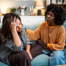 One person reassuring another during a conversation