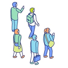 One person walking behind a group of people.