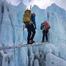 A mountaineer ascending a steep section of Mount Everest.