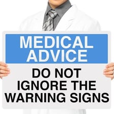 A person turning away from a document containing an important warning.