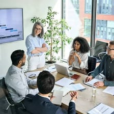 A leader guiding a team during a meeting