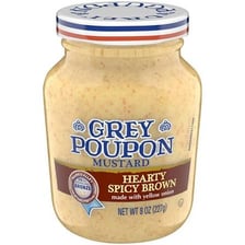 Jars of Dijon mustard and spicy brown mustard displayed together