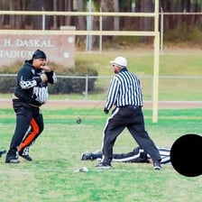 A referee awarding a game by forfeit