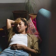 A person resting in a visibly lethargic state