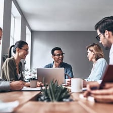 A group of employees working together in an office.