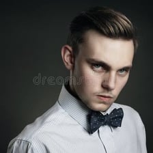 A portrait of a person displaying a firm, intense, determined gaze
