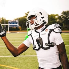 An American football player wearing protective shoulder pads.