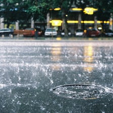 Fine, light rain falling over a street