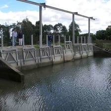 Large floodgates controlling water flow in a canal