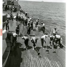 Enlisted sailors working aboard a naval ship