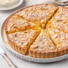 A pastry tart filled with pale almond frangipane cream