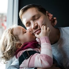 A parent expressing unusually strong affection toward a child