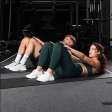 A person performing exercises that work the abdominal muscles.