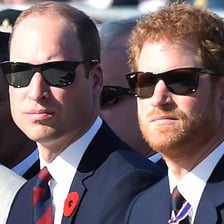 British man with a restrained, serious expression