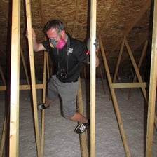 A home inspector examining the interior of a house during a property inspection.