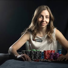 A poker player displaying confident body language while bluffing at a card table