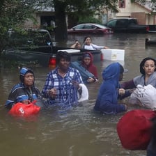 A street covered by floodwater, illustrating the literal sense of inundated